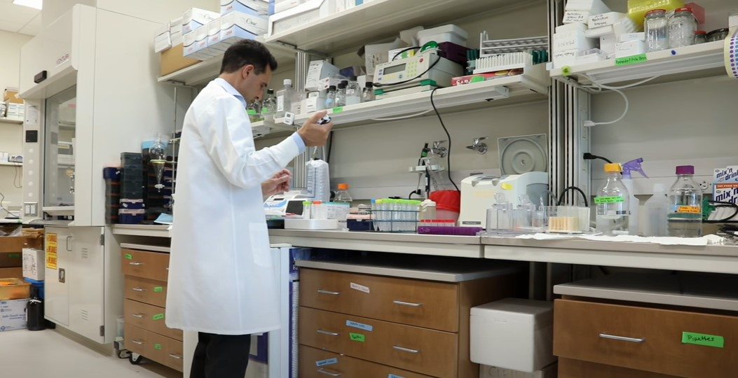 man working in laboratory wearing lab coat