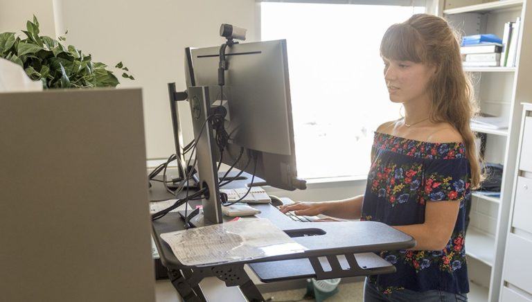 woman working at computer desk