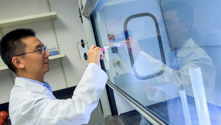 man in laboratory wearing lab coat
