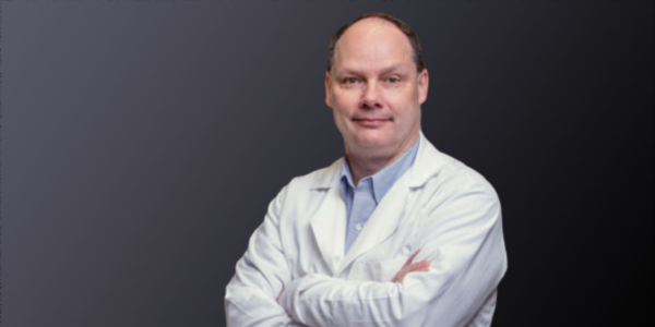 Man In White Lab Coat With Blue Background